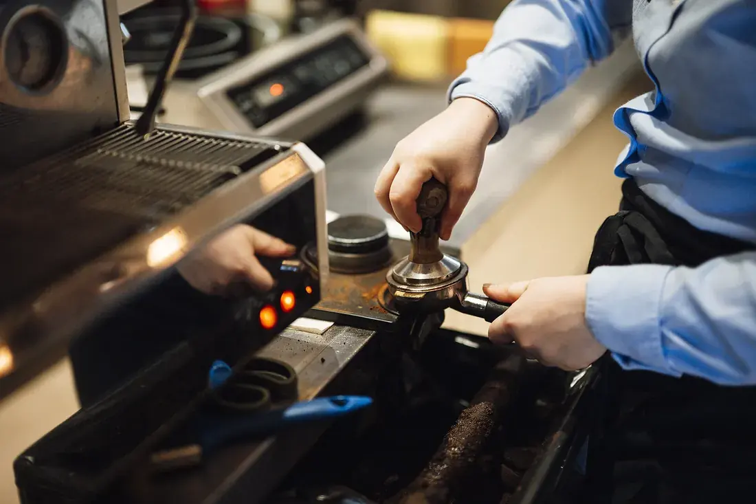 Barista pouring latte art